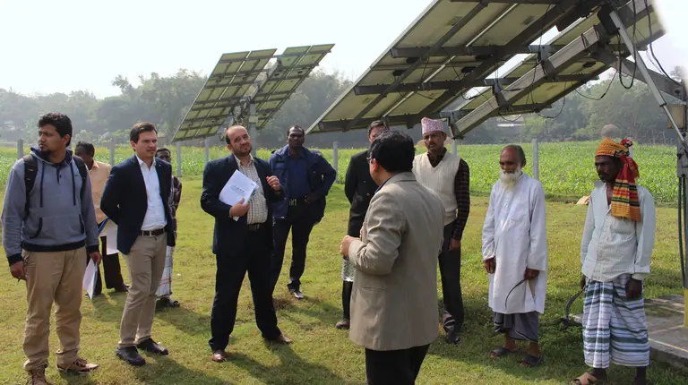 Officials on a climate finance course meet farmers in Bangladesh to learn about the benefits of solar irrigation pumps (Photo: ICCCAD, Creative Commons via Flickr)