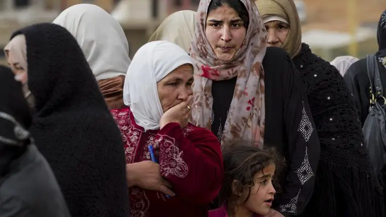 Three generations of Syrian refugees queuing at a registration point on the Syria/Lebanon border. The United Nations says 4.8 million people have fled the conflict in Syria (Photo: UNHCR/ M. Hofer, Creative Commons via Flickr)