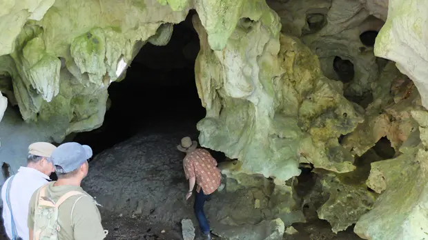 A tour group from ecotourism business Adventures in the Last Corridor explore possible caving tour options (Photo: Cathy Smith)