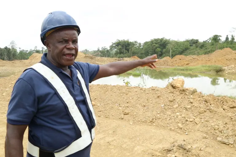 Jonathan Tettay points to pond