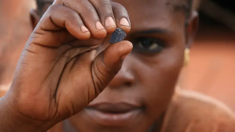 Close up of woman sorting stones