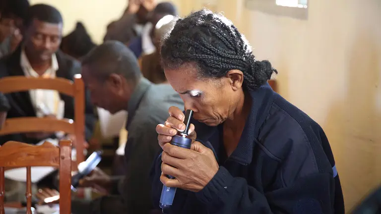 Jocelyne inspecting a gemstone