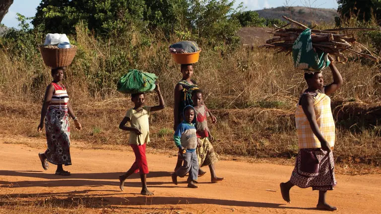 Villagers walking back to their village, Mozambique (Image: Mike Goldwater)