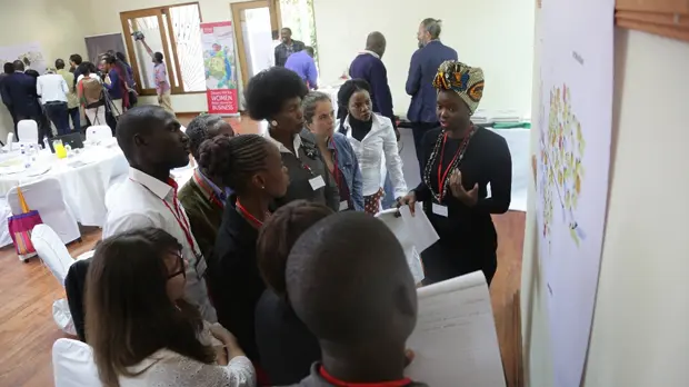 Participants in a May 2017 Food Change Lab held in Lusaka, Zambia, discuss a map of the food system (Photo: Salimu Dawood) Participants in a Food Change Lab in Lusaka, Zambia gather around a presentation (Photo: Salimu Dawood)