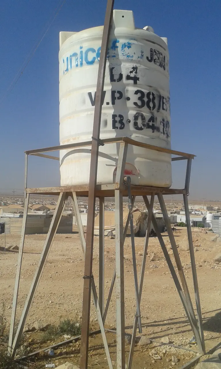 A water tank provided by UNICEF and its partners in Za'atari camp. Due to prolonged crises, supporting organisations have aimed at addressing local capacities as much as urgent needs (Photo: Loan Diep)