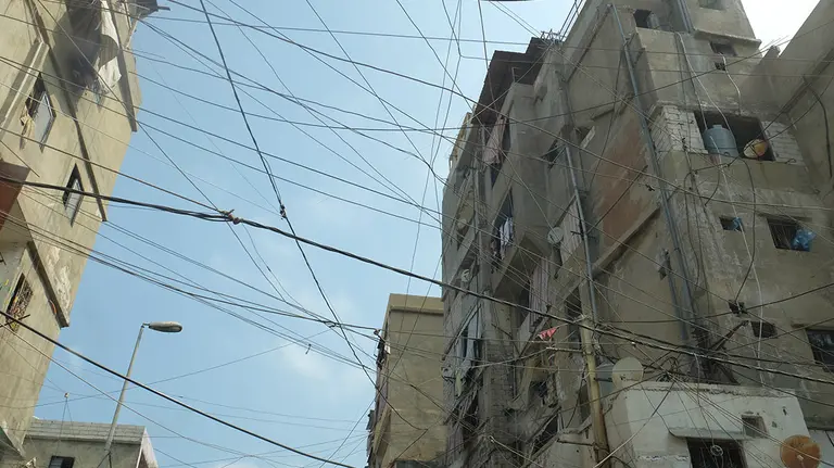 When infrastructure is not provided, or not affordable, the urban poor find their own way around the problem, as in Delhi, India, where electricity is tapped