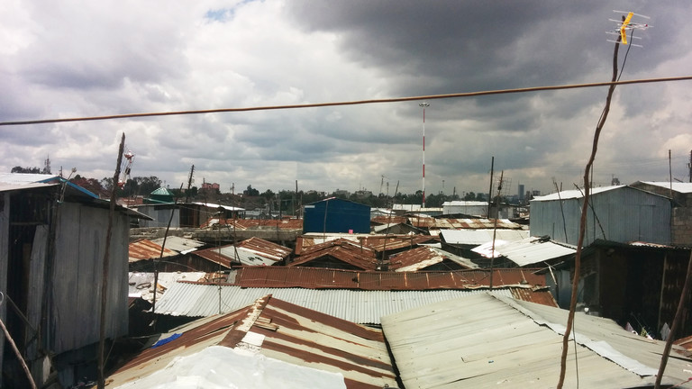 View over the Mukuru informal settlement in Nairobi, showing corrugated roofs