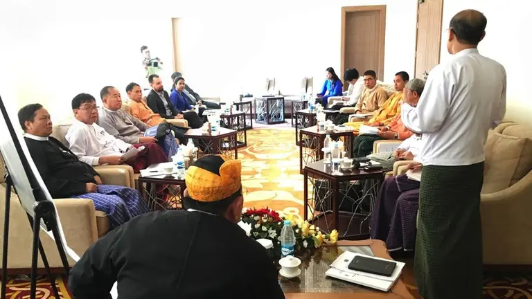 Men sitting in a conference room