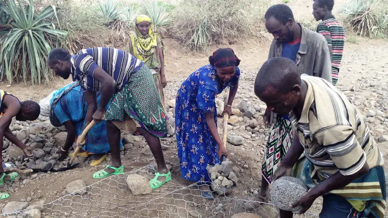 Enhancing resilience through adaptation: Community Managed Disaster Risk Reduction committee members undertake flood prevention work  in Ethiopia (Photo: USAID, Creative Commons via Flickr)