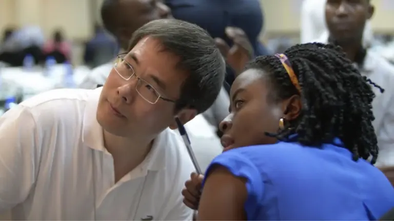 Anna Amumpire and Zhong Chen at international learning event in Mozambique 2017