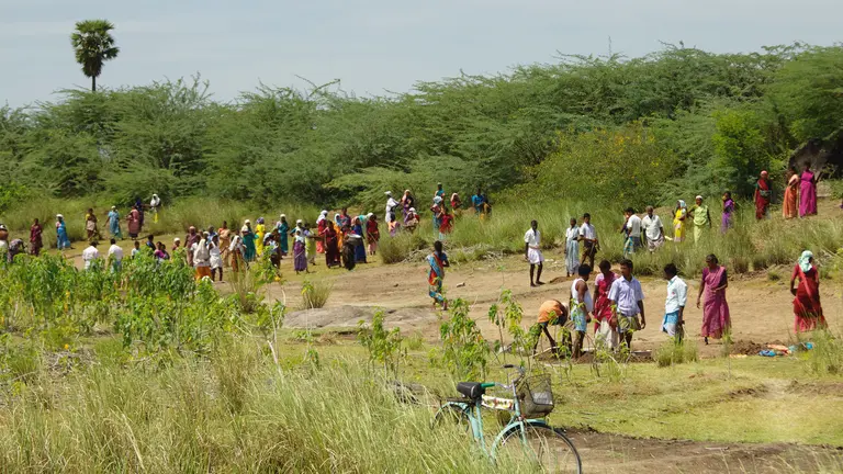 Villagers in India dig out a silted-up water tank as part of the Mahatma Gandhi National Rural Employment Act (Photo: McKay Savage, Creative Commons via Flickr)
