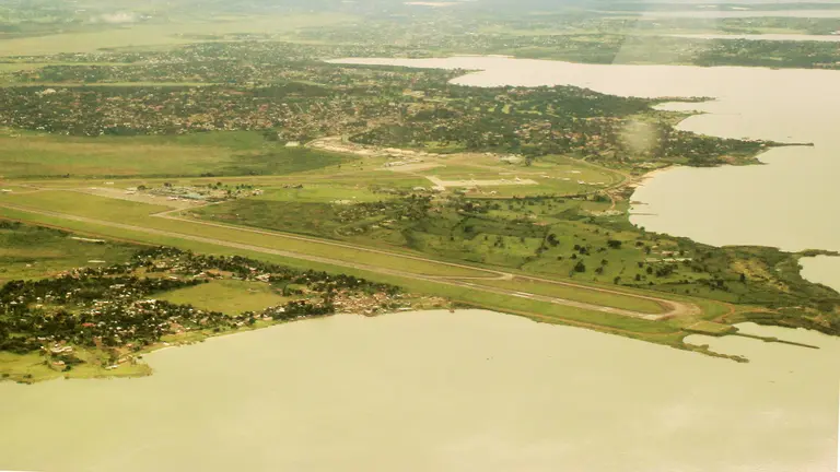 An aerial view of Entebbe airport. The airport is located on the shores of Lake Victoria, close to numerous environmentally sensitive wetland areas (Photo: Niranjanoak, Creative Commons via Wikipedia)