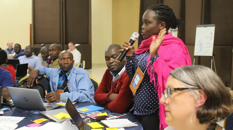 Participants at CBA conferences, are encouraged to be active and vocal. Here, an attendee joins a discussion at CBA12 in Malawi (Photo: Teresa Corcoran/IIED)