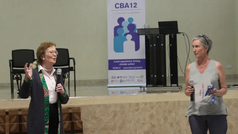 Former President of Ireland Mary Robinson (left) and IIED's director of climate change Clare Shakya talk to participants at CBA12 in Malawi (Photo: Teresa Corcoran/IIED)