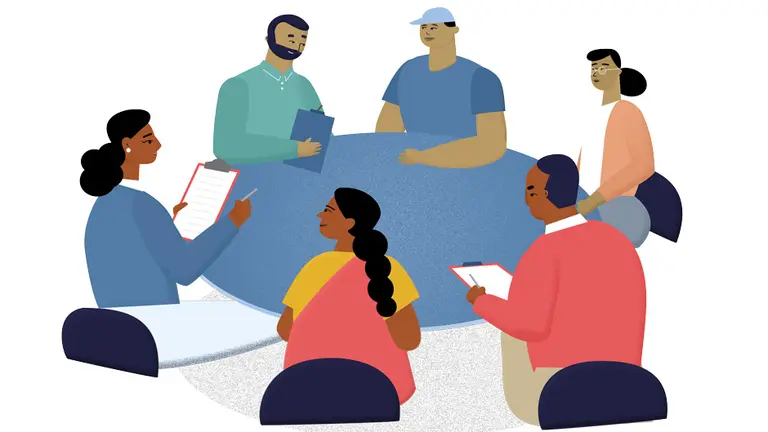 People discussing around a table