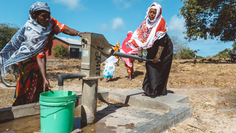 Women collecting clean water at a water pump