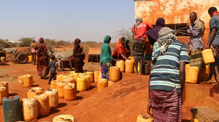 Women fetching water at a water kiosk