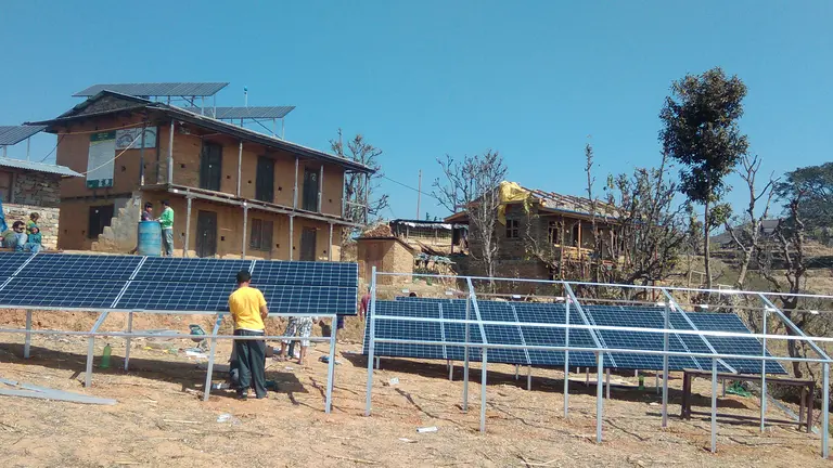 People putting up solar panels
