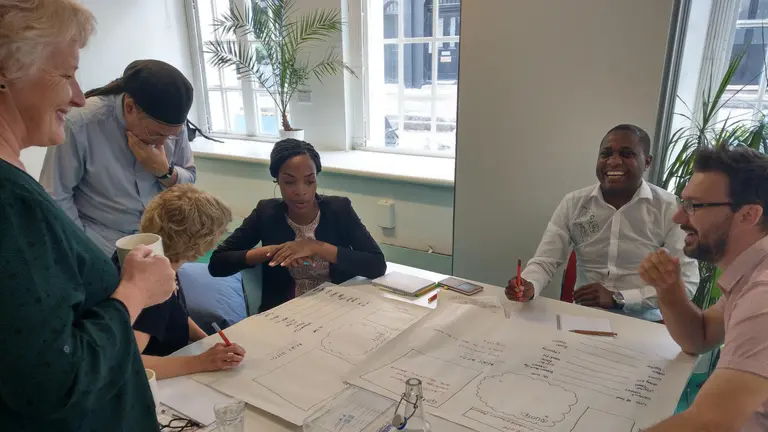 A group of people working at a table