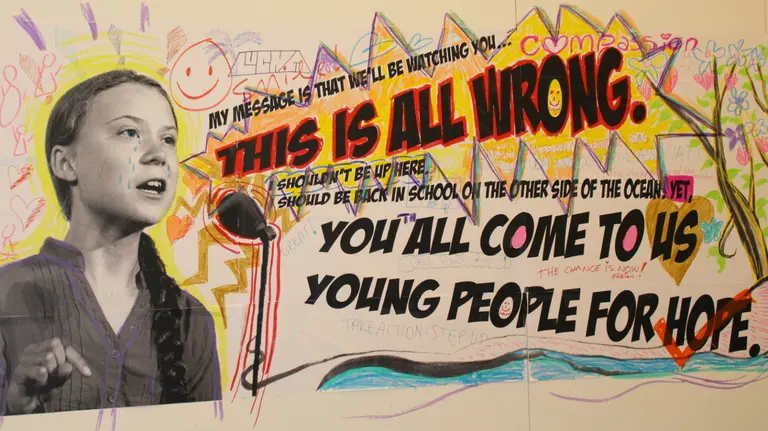An image of youth climate leader Greta Thunberg on a mural, with her speech: "You all come to us young people for hope. This is all wrong"