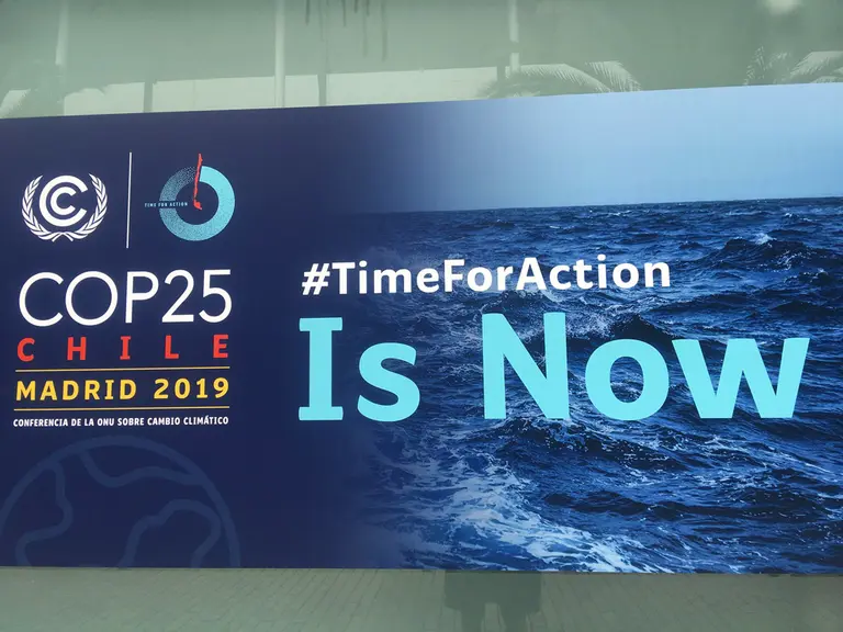 Large COP25 banner with the tagline: time for action.