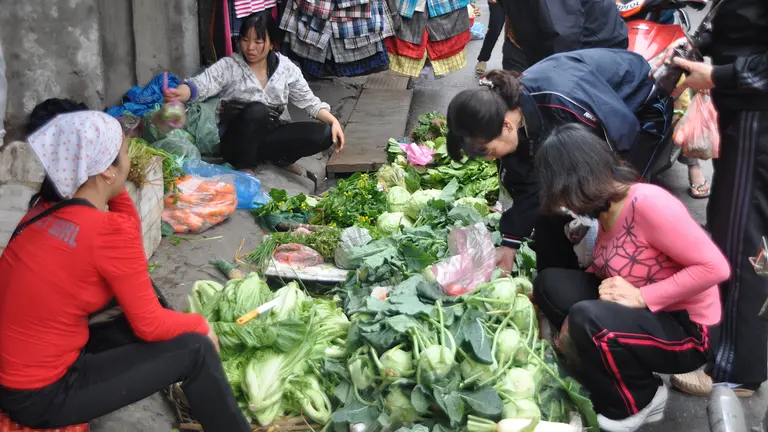 a vegetable seller and customers