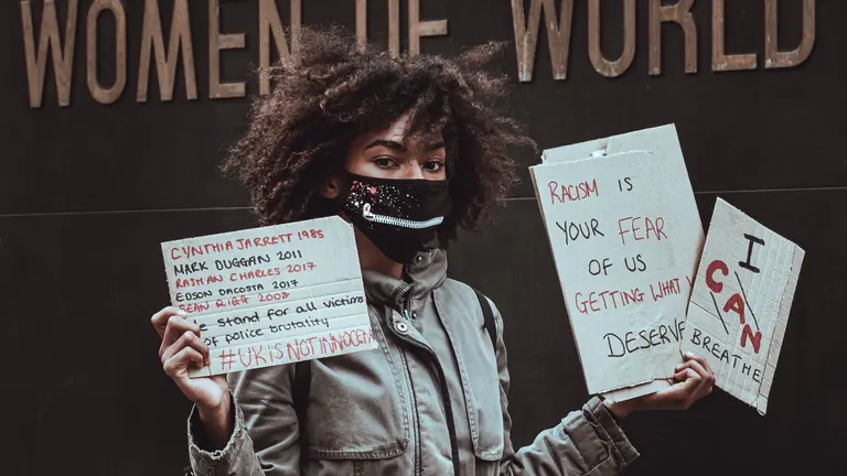 A woman holding signs