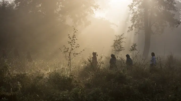 Women cross a river 