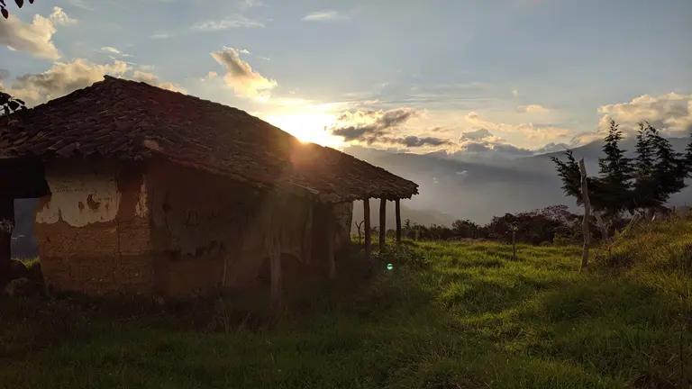 Mountain house with rays of sunshine 