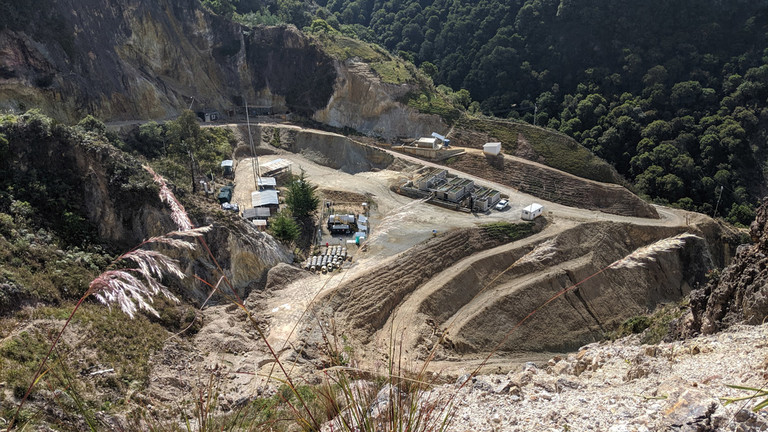 View looking down on a mining project in the mountains
