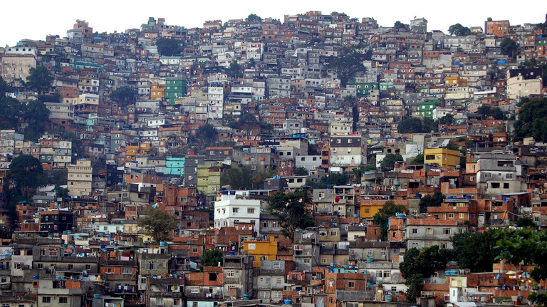 Hundreds of homes are crammed together up the side of a hill
