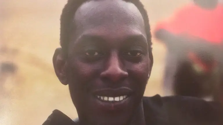 Headshot of a young Adam Thiam in 1982