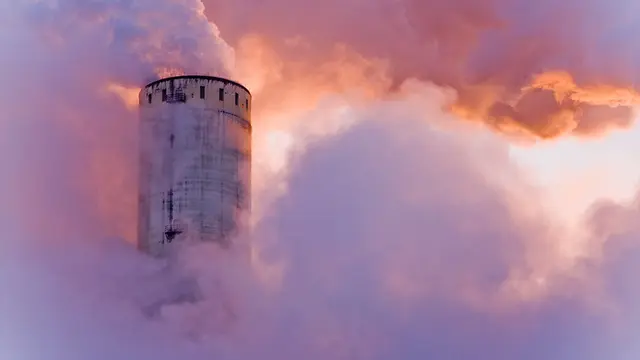 A chimney expelling smoke.