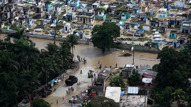 Aerial view of a flooded city with destroyed housing and infrastructure