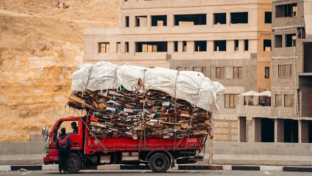 Truck carrying a huge load of cardboard.