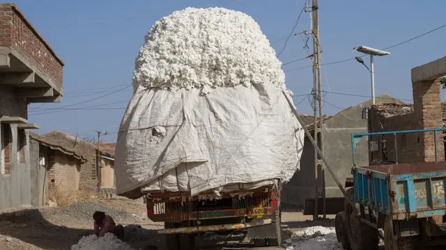 Truck piled up high with cotton in India