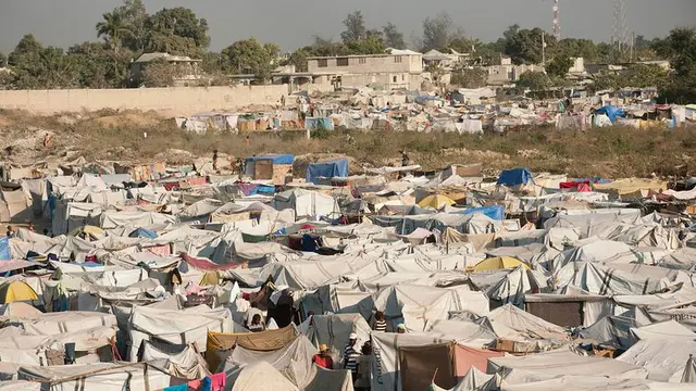 A number of informal tents forming a village.