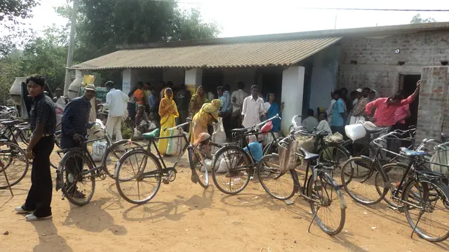 People queuing up in front of government ration centre to get food grain