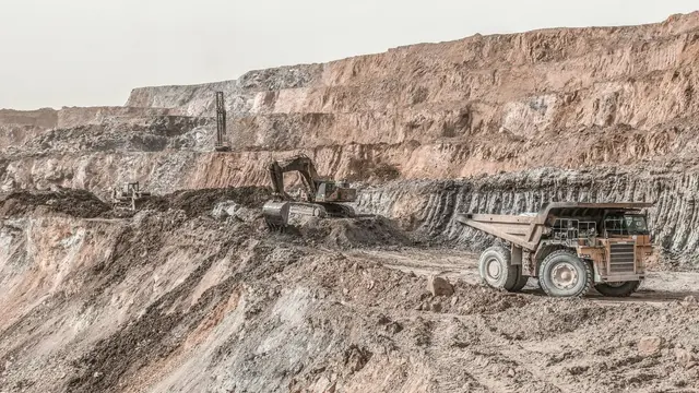 Image of trucks working in a copper mine