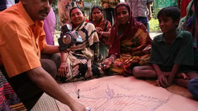 Participants study a map in Bangladesh. Photo: Isabelle Lemaire