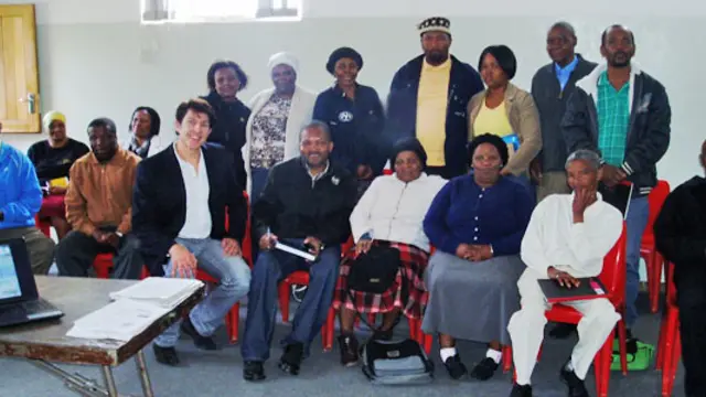 Group of standing and seated people pose for a photo