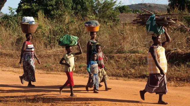 Villagers walking back to their village, Mozambique (Image: Mike Goldwater)