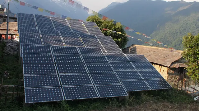 A large solar panel with Nepalese mountains in the background.