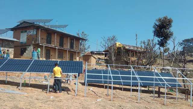 People putting up solar panels