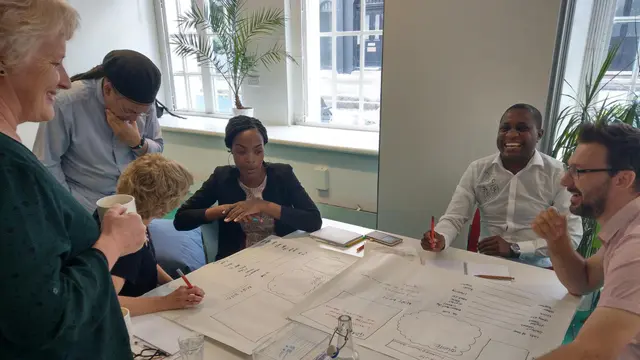 A group of people working at a table