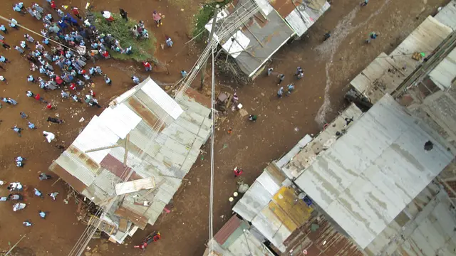 An aerial view of people in an informal settlement
