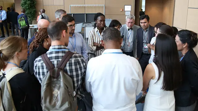Group of people talking in a circle