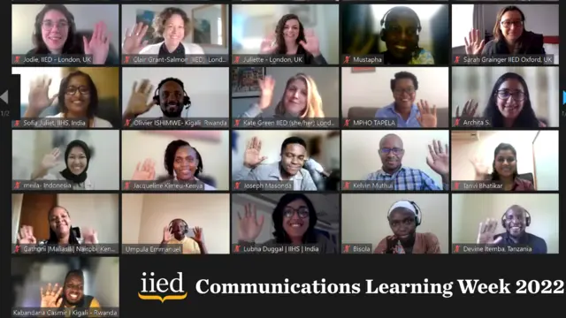 Screenshot of a videocall with 21 people waving at the camera