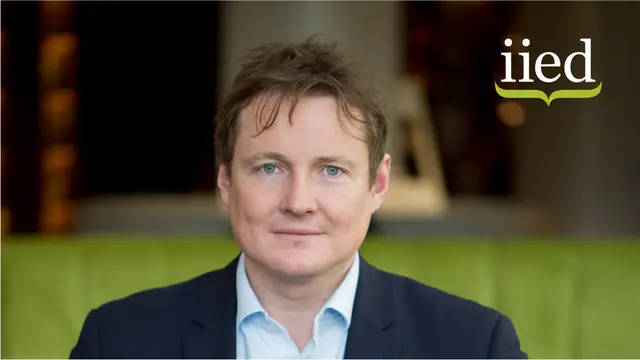 Headshot of Tom Mitchell with IIED logo in the top right corner.
