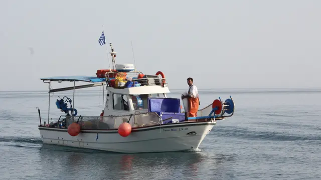 A small fishing boat on the sea. 